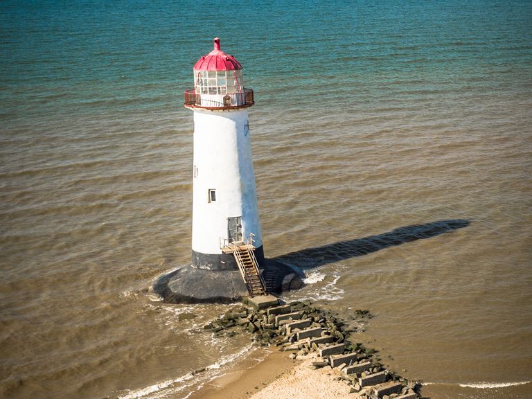 Visit Wales lighthouse beach 
